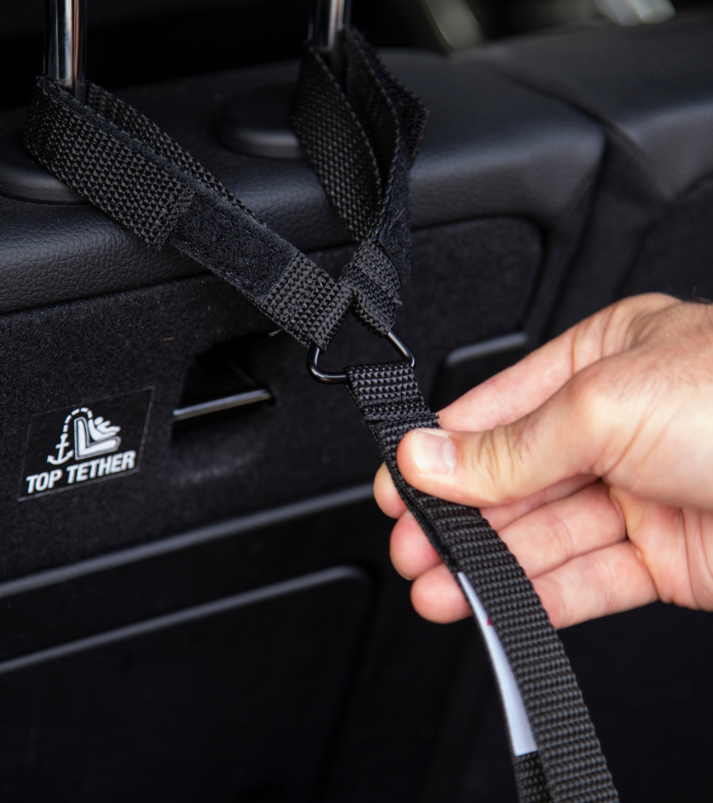 Stop the useless soccer mom arm move.   Get a Strap for that and prevent your passenger seat purse spills forever